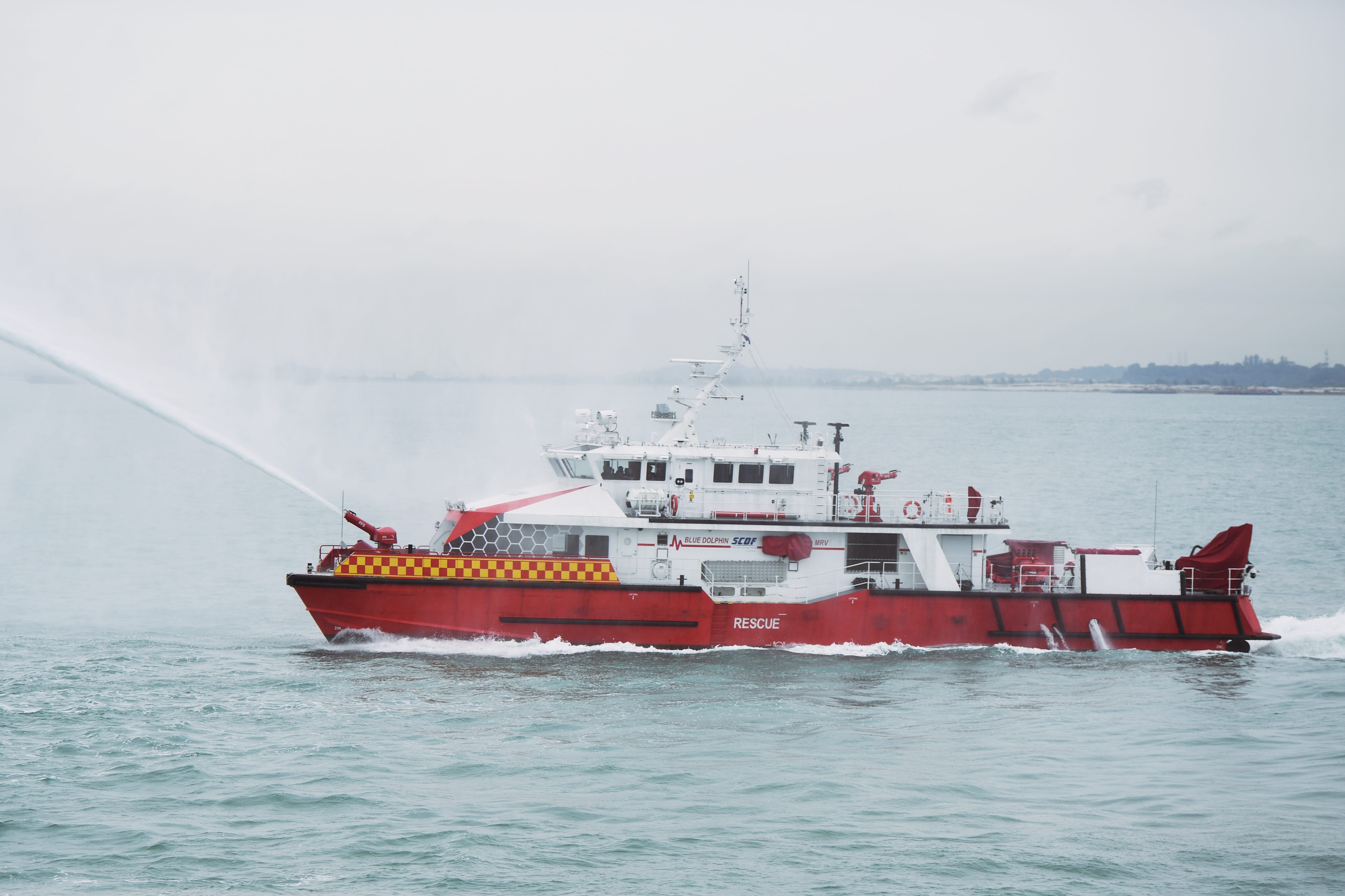 The Singapore Civil Defence Force’s (SCDF) Blue Dolphin, a Marine Rescue Vessel (MRV), extinguishing a simulated fire.